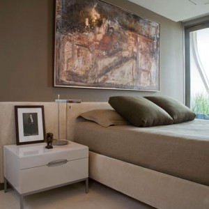 This contemporary bedroom in Washington DC has natural light and a view of the monuments