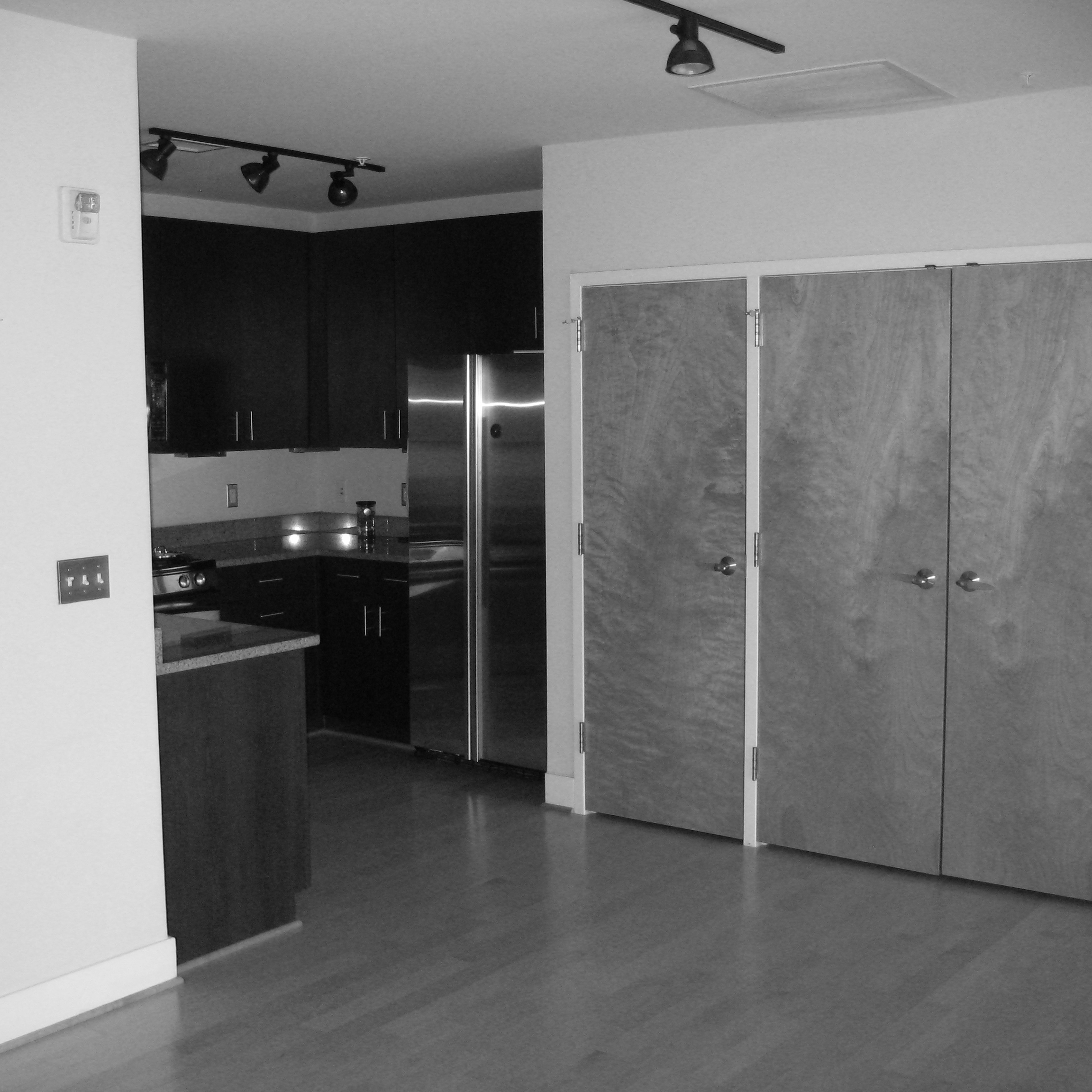 In this before and after, a dark, confined kitchen is opened up to the airy living space, by Washington, DC architect and interior design firm Ernesto Santalla, PLLC