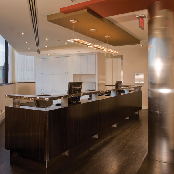 Custom reception desk for commercial office space design by Washington, DC architect and interior design firm Studio Santalla