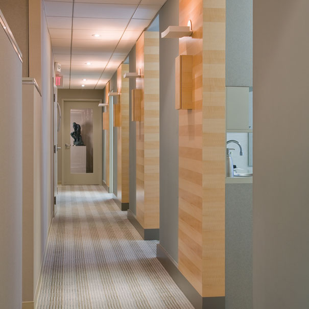 These contemporary Washington, DC offices by Studio Santalla uses wood finishes and great lighting.