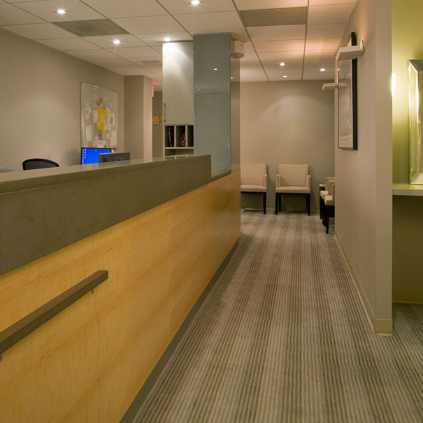 Contemporary office reception area by Washington, DC Architecture and Interior Design firm, Studio Santalla