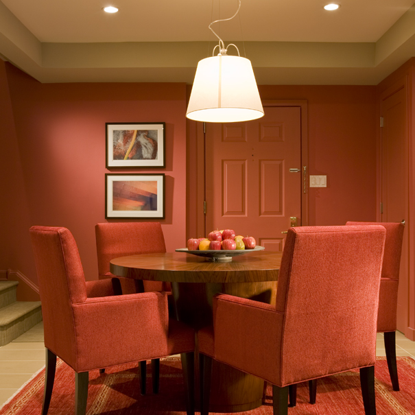 This dining room, by Washington, DC architecture firm, Studio Santalla utilizes bold colors and contemporary furniture