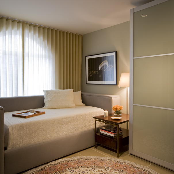A tempurpedic adjustable bed and PAX wardrobe from IKEA have been given a custom touch by Washington, DC interior Design firm, Studio Santalla