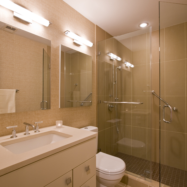 Studio Santalla's remodel of this bathroom included contemporary tile, neutral colors and plenty of light