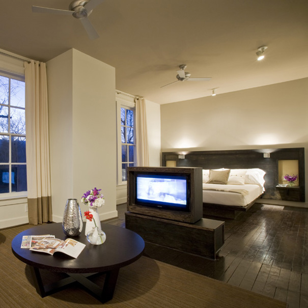 contemporary suite with built in bed and swiveling television