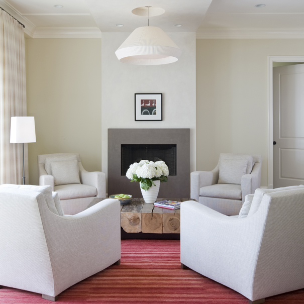 Contemporary living room with flush fireplace and reclaimed wood table