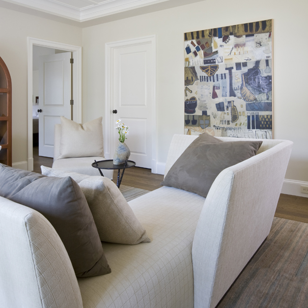 contemporary sitting room with island sofa and modern art