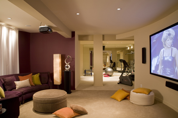 Studio Santalla transformed this Washington, DC area basement into an open plan multipurpose space with a home theater and fitness studio