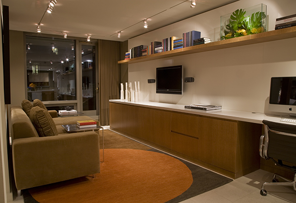 Upscale custom built-in cabinetry and shelves maximize space in this small yet luxurious Washington, DC apartment by Architect and Interior Design firm Studio Santalla