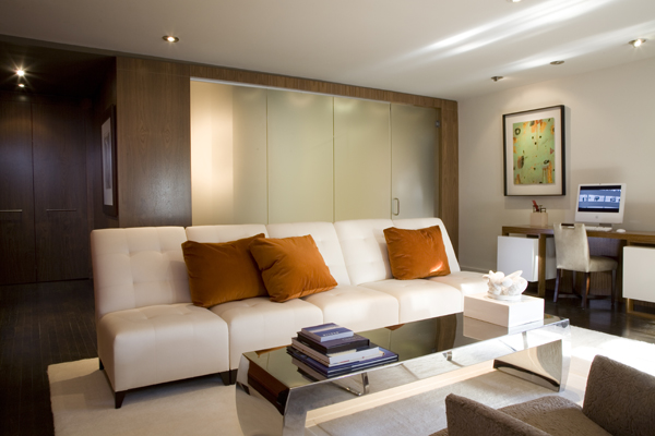 Frosted glass allows natural light to penetrate this condo by Washington, DC architect and interior design firm Studio Santalla.