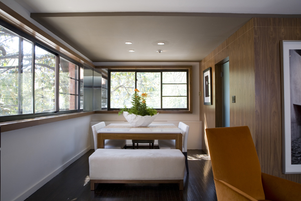 The light and airy dining room of this modern condo by Washington, DC Architects Studio Santalla