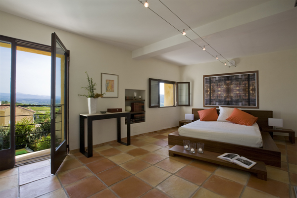 Modern furniture and terra cotta tile complete this bedroom renovation by Washington, DC Architect and Interior Design firm, Studio Santalla