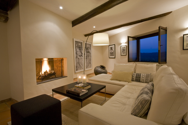 The fireplace is the centerpiece of this living room remodel by Georgetown Architect and Interior Design firm Studio Santalla