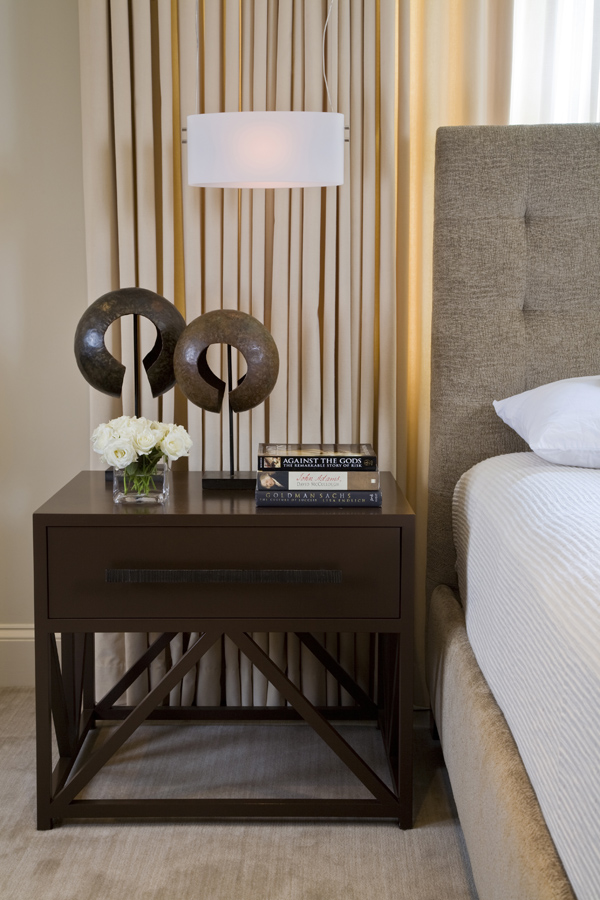 Elegant furniture and eclectic accessories complete this master bedroom suite by Washington, DC architect and interior design firm Studio Santalla. 