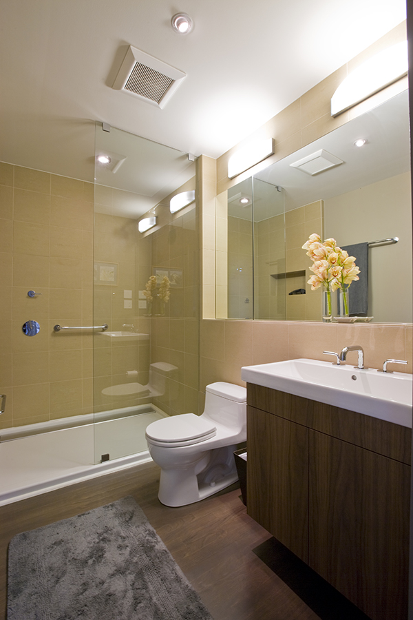 Bathroom with glass shower by Washington, DC Architecture and Interior Design firm Studio Santalla