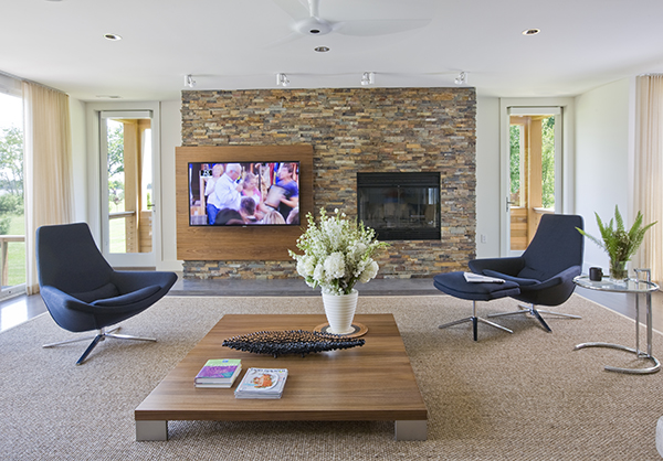 Contemporary, custom designed media center and fireplace on the Eastern Shore by Washington, DC Architecture and Interior Design firm Studio SantallaSantalla