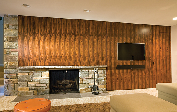 Midcentury inspired basement fireplace feature wall by Washington, DC Architecture and Interior Design firm Studio Santalla