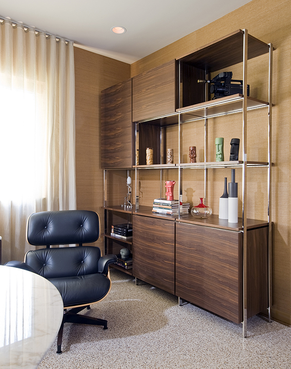 A custom storage unit completes this midcentury inspired basement home office by Washington, DC architect and interior design firm Studio Santalla