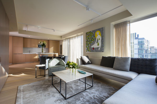 The living space, with contemporary furniture and views of the City Center plaza.