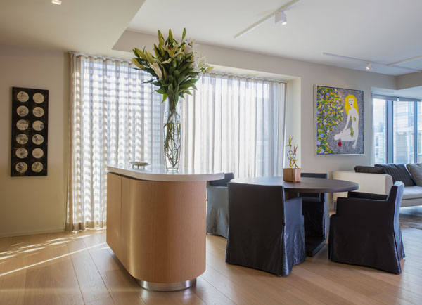 Contemporary furniture in the the Dining space, bathed in natural light from the City Center plaza.